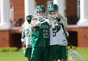 Lacrosse team members pointing at something. Links to Gifts That Protect Your Assets