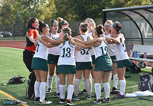 A group of girls huddle up to discuss their plans for the game. Links to Gifts from Retirement Plans